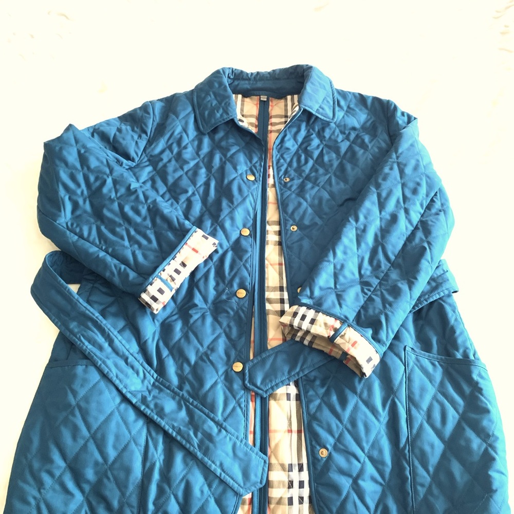 Burberry brit quilted long jacket in teal color.